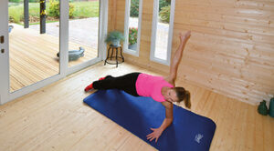 A garden room being used as a yoga studio.